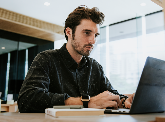 man-working-on-a-computer-8K37CBJ